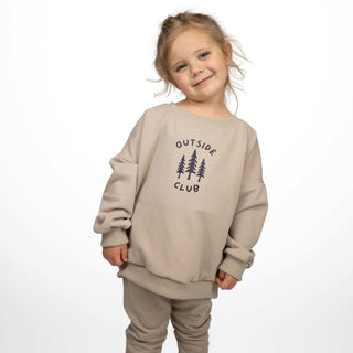 Toddler wearing our Outside Club crewneck sweatshirt in beige, showing the oversized baggy style by My Mini Explorer. 