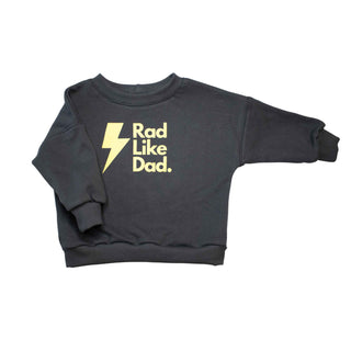 Children's Organic cotton crewneck sweater with a graphic design stating "rad like dad". The color is graphite, and also has a lightning bolt prior to the saying. 