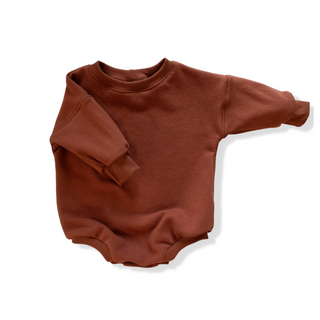 Tawny colored organic cotton sweater romper. 