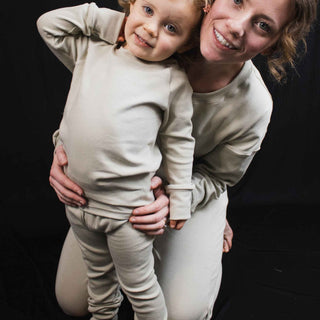 Picture of a mom and her best friend wearing sage green pajamas. Handmade in My Mini Explorers family owned and operated workshop. 