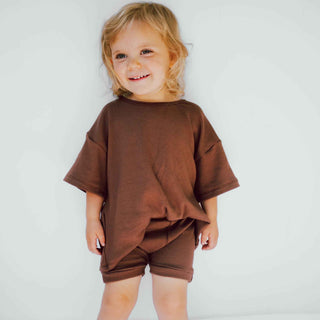 This is an oversized unisex styled baby - toddler t-shirt/shorts. The color is brown.