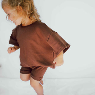 This is an oversized unisex styled baby - toddler t-shirt/shorts. The color is brown.
