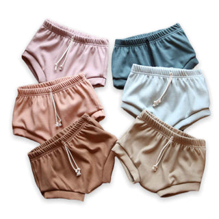 Ribbed organic cotton shorts coming in the colors petal, spruce, eucalyptus, rose clay, maple, and parchment. Handmade by My Mini Explorer in their family owned and operated workshop.  